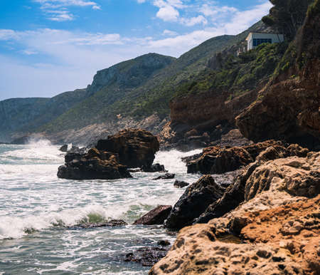 Cliffs with a house on top. The Rotas, Denia.の写真素材