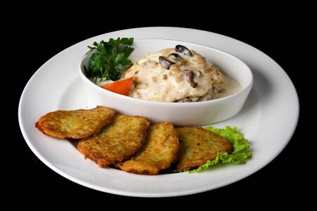 potato pancakes with sour cream and mushroomsの写真素材