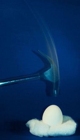 Hammer about to break an eggの写真素材