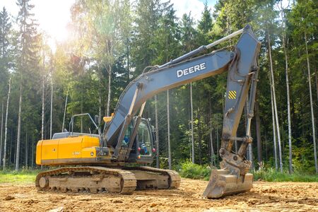 RUSSIA, MOSCOW - September 01, 2019: Industrial road construction site, highway building. Heavy duty machinery excavator on site.のeditorial素材
