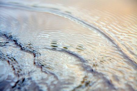 water ripples on the surface of a puddle. abstract backgroundの写真素材