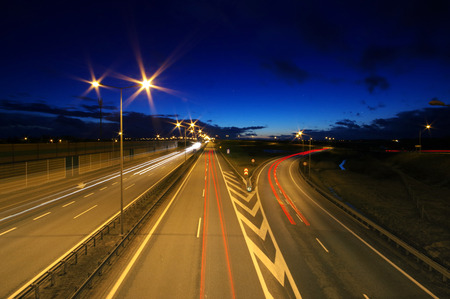 Car lights at night on highway