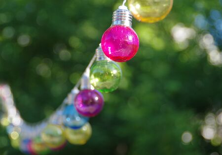 Colorful vitreous bulbs. Lamps on wire.の写真素材