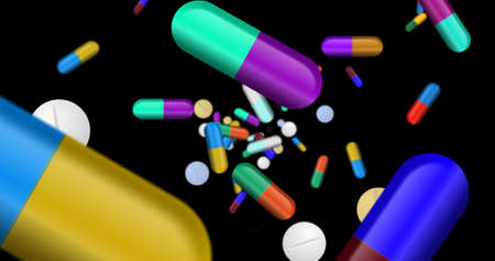 Medicines pills, tablets and color capsules falling. Concept of health, cure and pharmacy.の写真素材