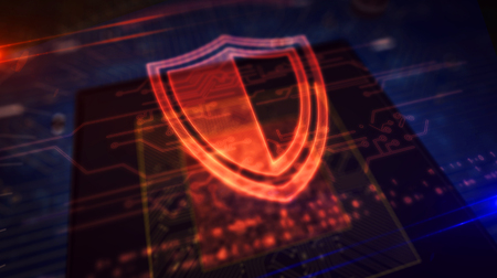 Cyber security concept with shield hologram over working cpu in background. Digital protection,...