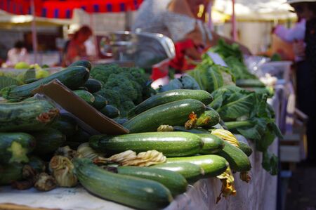 Courgettes at the town market. Fresh, healthy vegetables for sale.の写真素材