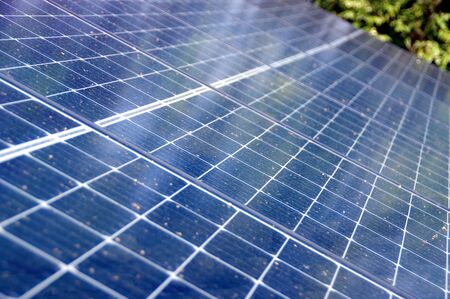 Photovoltaic panels on house roof. Alternative and renewable energy, green power, ecology and solar...