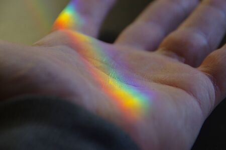 Light spectrum on the palm of handの写真素材