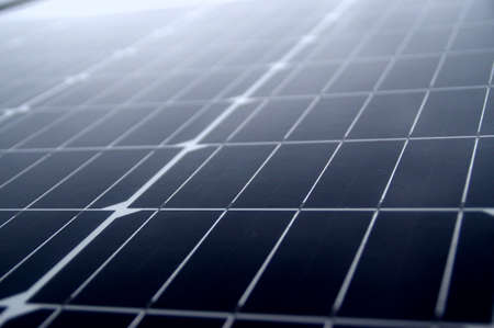 Wet solar panels on the roof. Photovoltaics at home in the rain.