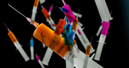 Medical syringes falling, full of drugs or vaccine. Healthcare, science, medicine, health and cure...