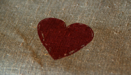 Heart health and love symbol stamp printed on linen sack. Romantic, cardio, celebration message concept.の写真素材