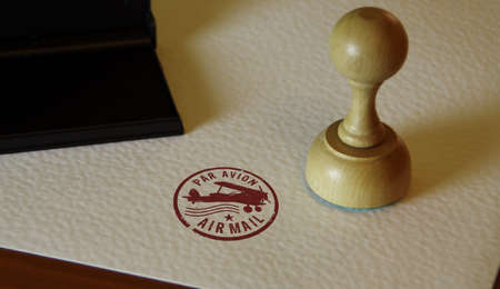 Air Mail stamp and stamping hand. Retro par avion post letter delivery and airmail express postmark concept.の写真素材
