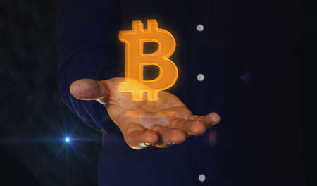 Bitcoin blockchain crypto currency and digital money 3d symbol over man hand. Cyber technology icon...