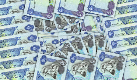 Arab Emirates Dirhams banknotes in a cash fan mosaic pattern. Dubai 500 AED notes. Abstract concept...