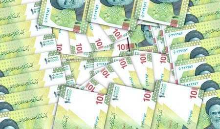 Iran Rial banknotes in a cash fan mosaic pattern. Iranian IRR 10000 notes. Abstract concept of bank,...
