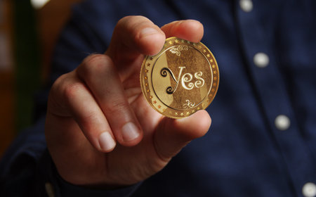 Yes or No random decision choice and gamble golden coin in hand abstract conceptの写真素材