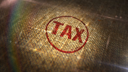 Tax stamp printed on linen sack. Income taxation and payment concept.の写真素材