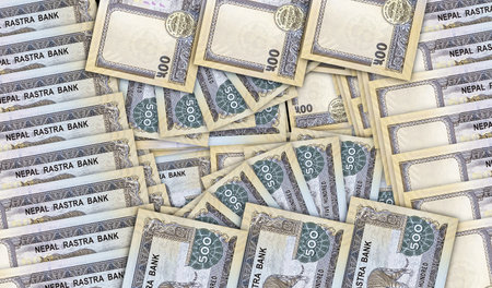 Nepal rupee banknotes in a cash fan mosaic pattern. Nepali NPR 500 money notes. Abstract concept of bank, finance, economy decorative design background 3d illustration.の写真素材