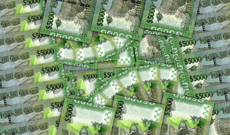 Guyana dollar banknotes in a cash fan mosaic pattern. Guyanese GYD 5000 money notes. Abstract...