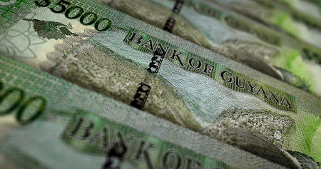 Guyanese dollars money printing 3d illustration. 5000 GYD banknote print. Concept of finance, cash, economy crisis, business success, recession, bank, tax and debt in Guyana.の写真素材