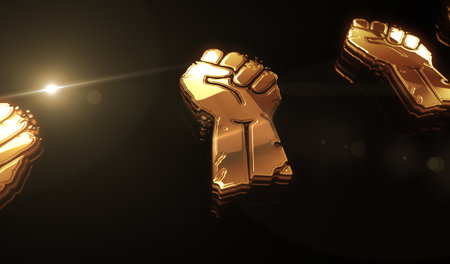 Freedom fight revolution with clenched fist golden metal shine symbol concept. Spectacular glowing and reflection light icon abstract object 3d illustration.の写真素材