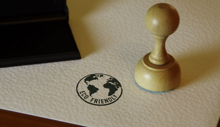 Eco friendly with globe symbol stamp and stamping hand. Planet earth environment protection concept.の写真素材
