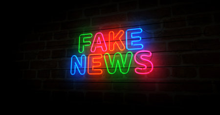 Fake news hoax neon symbol. Propaganda and disinformation light color bulbs. Abstract concept 3d illustration.の写真素材