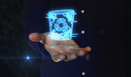Trash waste management and delete bin 3d symbol over man hand. Cyber technology icon abstract concept 3d illustration.の写真素材