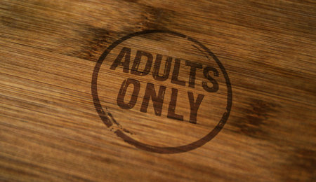 Adults only 18 plus age prohibition stamp printed on wooden box. Under eighteen restricted concepts.の写真素材