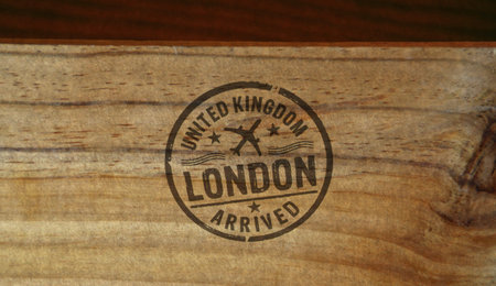 London England arrived stamp printed on wooden box. Great Britain flight arrival concept.