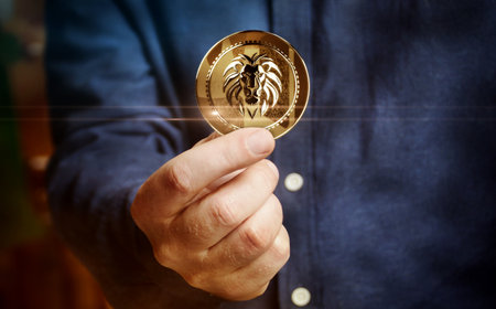 Lion symbol golden coin in hand abstract conceptの写真素材