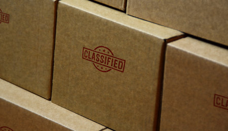 Classified stamp printed on cardboard box. Top secret government document concept.