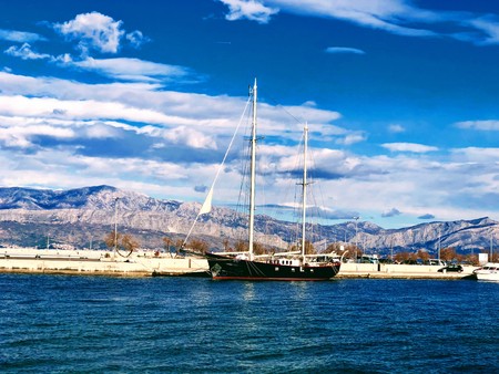 Sailing in blue sky and blue waterの写真素材