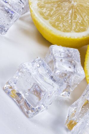Lemon with ice cubes in a bowl.の写真素材