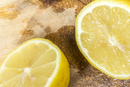 Lemon with ice cubes in a bowl.