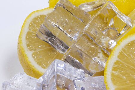 Lemon with ice cubes in a bowl.の写真素材