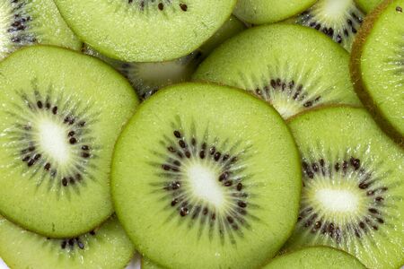 Kiwi fruit slices in a bowl.の写真素材