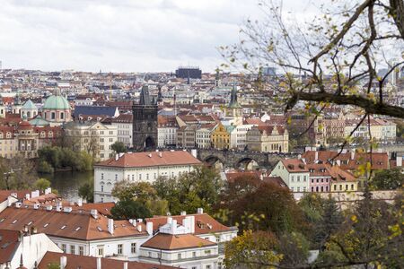 The famous red rooftops of Prague with the Charles Bridge in the foreground view from the castle hill.のeditorial素材