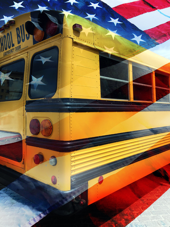 School bus and american flag backgroundの写真素材