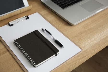 Laptops and home workspace tables around