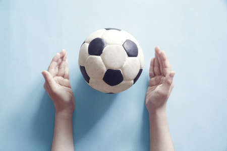 Stay Home Message with Children's Hands and Soccer Ballsの写真素材