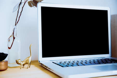 Snap photos around laptop and workspace tableの写真素材