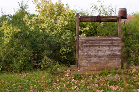 Rural well in the greenery in summerの写真素材