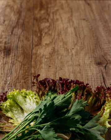 green salad and parsley lie on the table, the concept of proper nutrition, diet,の写真素材