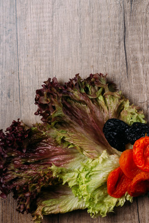 prunes and dry apricot lie on a wooden table, the concept of proper nutritionの写真素材