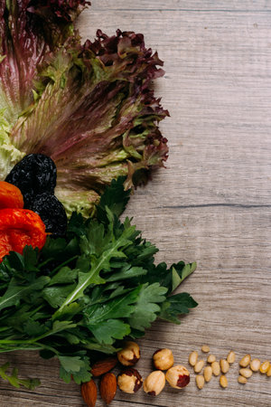 hazelnut, bread, dry apricot lie on a wooden table, the concept of proper nutritionの写真素材