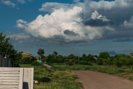 Cumulus clouds over a village in the Black Forest. summer for dreamsの写真素材