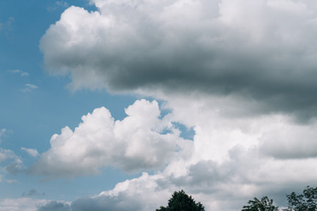 Cumulus clouds over a village in the Black Forest. summer for dreamsの写真素材