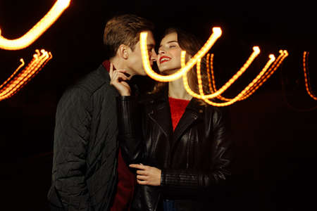 black background, couple dancing in the lights of light, dance of light, music of light, holidayの写真素材