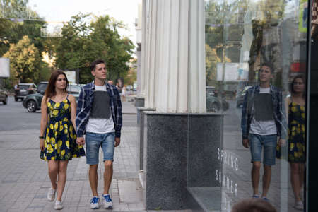 the couple smiles and walks around the city, and goes shopping, autumn and spring.shopping,の写真素材